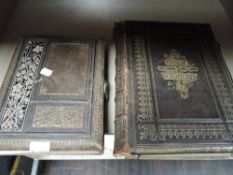 A large leather bound family bible and a Victorian photograph album containing portraits