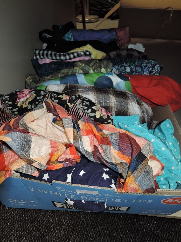 A mixed box of ladies clothing including silk skirt etc