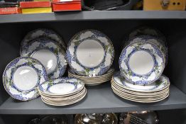 A good quantity of Royal Doulton 'Merryweather' plates and bowls.