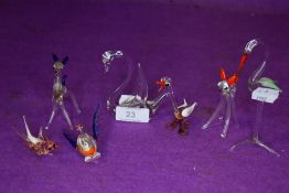 A collection of miniature glass animals.