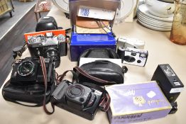 A selection of cameras and photographic equipment including Zenith E SLR, Canon Sureshot Tele