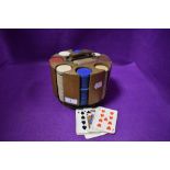 A Vintage rotating wooden poker chip caddy with cards and early plastic chips included.