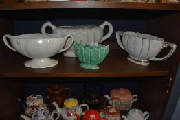 A collection of four rose bowls/handled flower urns including Beswick and Sylvac.