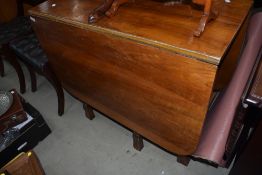 A mid 20th Century walnut drop leaf dining table