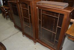 An early 20th Century mahogany display cabinet/bookcase of breakfront form , and wide proportions,