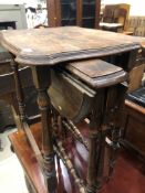 An early 20th Century oak occasional table having turned frame, nesting a pair of early 20th century