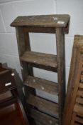 A set of vintage wooden step ladders