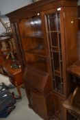 An early 20th Century mahogany bureau bookcase with open shelves flanked by display sides, width
