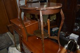 An early 20th Century stained frame occasional table having shaped top