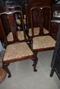 A set of four Queen Anne style mahogany vase back dining chairs