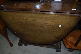 A vintage oak gateleg dining table