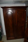 A Victorian mahogany wardrobe having panelled doors