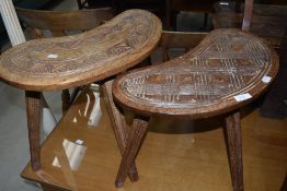 Two similar kidney shaped occasional tables, of ethnic design