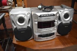 A Panasonic CD Stereo System , with 5 CD changer and twin cassette decks, model SA-AK18, includes