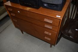 A vintage Golden oak bedroom chest of four graduated drawers, labelled Gomme, G plan