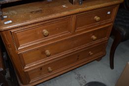 A natural pine chest of two over two drawers