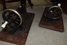 Two traditional hand crank sewing machines