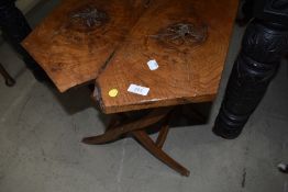 A rustic folding occasional table
