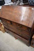 A 19th Century mahogany bureau of large proportions with fitted interior, drop flap and two over