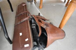 Three gun slips or leather case bags