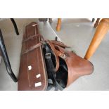 Three gun slips or leather case bags