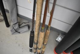 Four fly fishing rods and a landing net