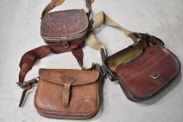 Three leather cartridge bags.