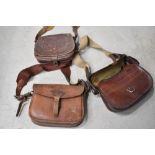 Three leather cartridge bags.