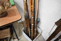 A large selection of vintage fishing rods.