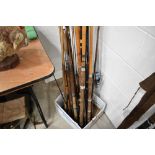 A large selection of vintage fishing rods.