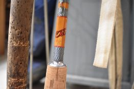 A split cane fly rod with spare tip marked EBISU in sleeve