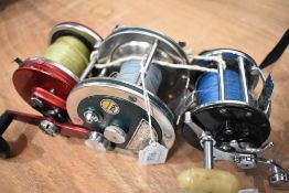 Three sea angling reels.