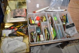 Two boxes of tackle and lures and one box containing flies and line.