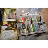 Two boxes of tackle and lures and one box containing flies and line.