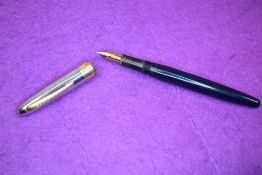 An Eversharp leverfill fountain pen with steel cap with gold trim having Eversharp nib. Approx 13.