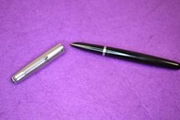 A Parker 51 fountain pen in black with brushed steel cap. Approx 13.7cm