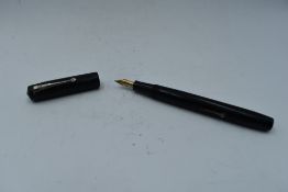 A Conway Stewart 472 'The Universal Pen' in HBR, leverfill with a 14ct gold nib, nib in poor