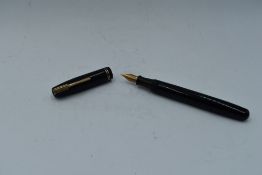 A Watermans leverfill fountain pen in Black two narrow bands with Watermans 5 nib. Approx 13.7cm