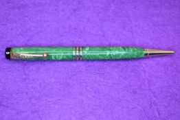 A Parker propelling pencil in jade green. Approx 12.5cm