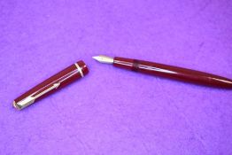 A Parker Victory fountain pen in red with single decorative band to cap having a Parker 10 nib.