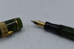 A Mabie Todd & Co Blackbird Self filler Leverfill fountain pen, in green marble, a Blackbird nib.