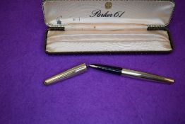 A Parker 61 fountain pen in rolled gold with engine turned decal. In original Parker 61 box.