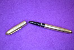 A Zenith Extra Laminata ORO 750 (Montegrappa) piston fill gold overlaid fountain pen. Approx 13.2cm