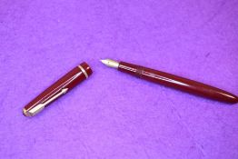 A Parker Victory fountain pen in red with single decorative band to cap having a Parker 10 4 nib.