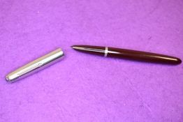 A Parker 51 fountain pen in dark burgundy with brushed steel cap. Approx 13.7cm