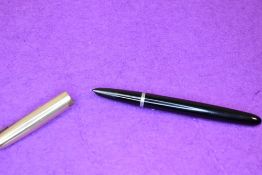 A Parker 51 fountain pen in black with 12ct rolled gold cap. Approx 14cm. Small dent to cap