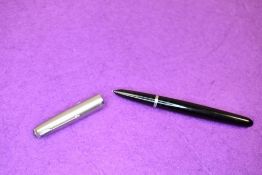 A Parker 51 fountain pen in black with brushed steel cap. Approx 13.7cm