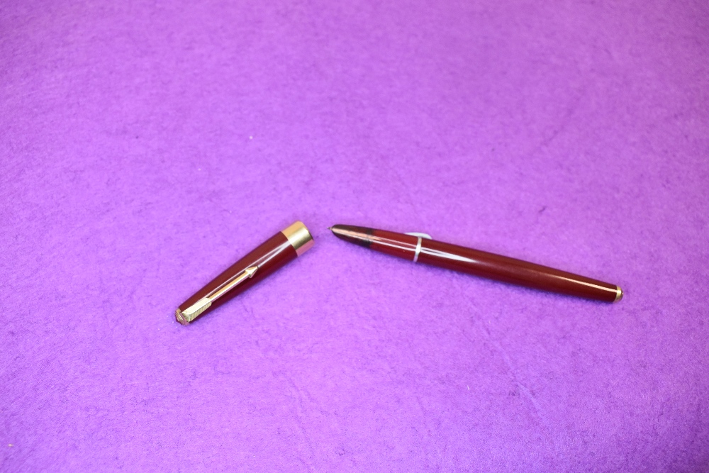 A Parker 17 in red with broad band to cap, approx 14cm