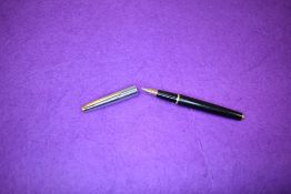 A Waterman fountain pen in black with silver cap with gold trim having Watermans no2 nib. Approx