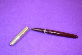 A Parker 51 fountain pen in burgundy with 12ct rolled gold cap. Approx 13.8cm.